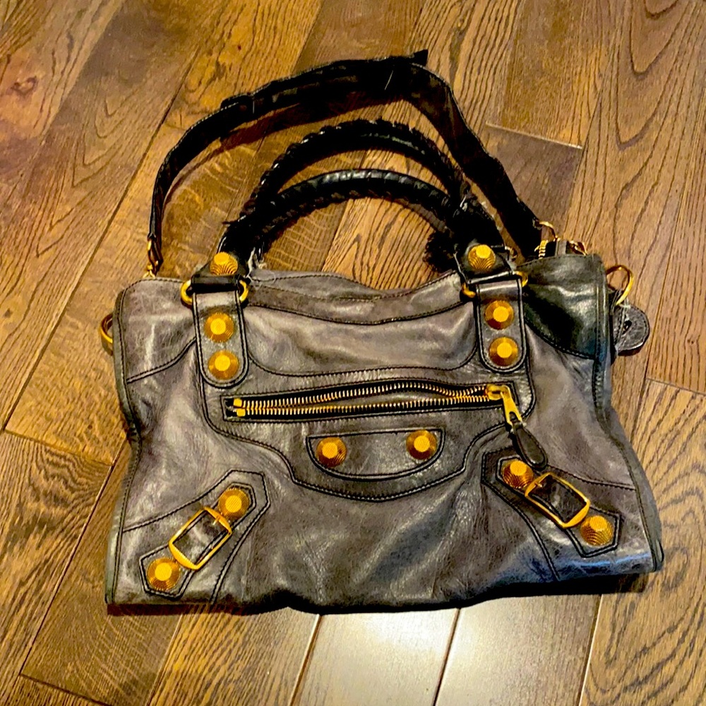 Balenciaga bag with gold colored hardware.